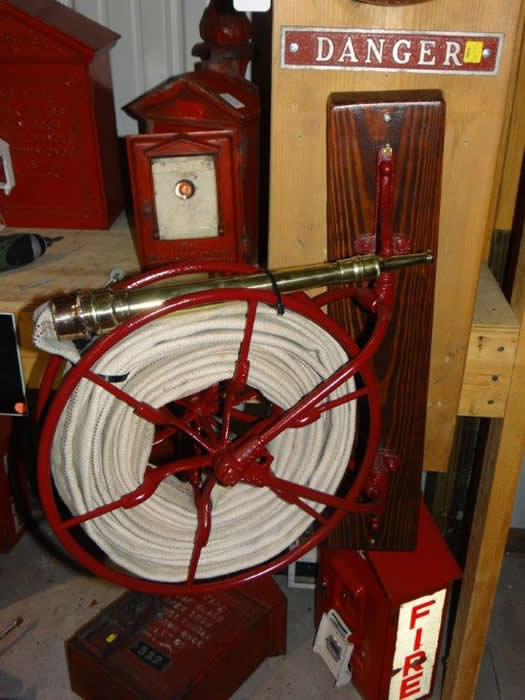 Late 1800's or Early 1900's Cast Iron Fire Hose Reel complete with wooden  Wall Mounting